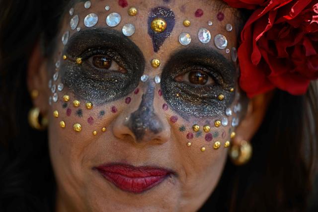 A participant poses for a picture during an LGBTIQ Pride parade in Caracas on October 31, 2025. (Photo by Federico PARRA / AFP)
