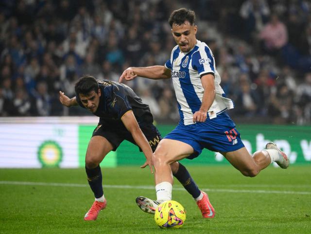FC Porto's Spanish midfielder #10 Gabriel Veiga scores his team's fourth goal during the Portuguese League football match between FC Porto and GD Estoril Praia at Dragao stadium in Porto on October 31, 2026. (Photo by Miguel RIOPA / AFP)