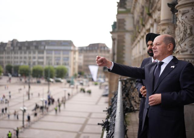 07 October 2024, Hamburg: German Chancellor Olaf Scholz (R) stands next to Ajay Banga, President of the World Bank, on the balcony of the Mayor's Office in City Hall before a bilateral meeting as part of the Hamburg Sustainability Conference. Photo: Marcus Brandt/dpa