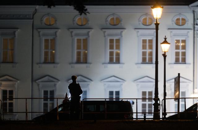 18 October 2024, Berlin: Police officers stand in front of Bellevue Palace, where US President Joe Biden will meet with the German President Frank-Walter Steinmeier. Just over three months before the end of his term of office, Biden has arrived in Germany for his first bilateral visit. Photo: Sebastian Gollnow/dpa