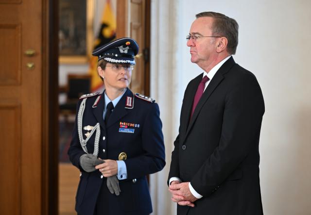 18 October 2024, Berlin: Boris Pistorius German Minister of Defense (R), and retired Colonel Gabriele Voyé await the arrival of US President Joe Biden at Bellevue Palace. It is Biden's first bilateral visit to Germany in his almost four years in office. Photo: Soeren Stache/dpa