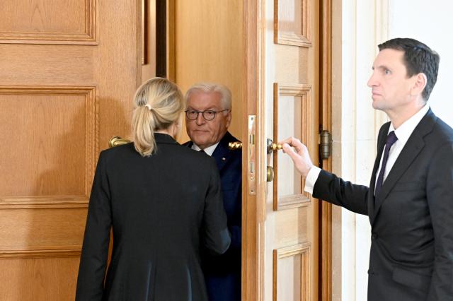 18 October 2024, Berlin: Frank-Walter Steinmeier (C), German President, waits in Bellevue Palace for the arrival of US President Joe Biden. It is Biden's first bilateral visit to Germany in his almost four years in office. Photo: Soeren Stache/dpa