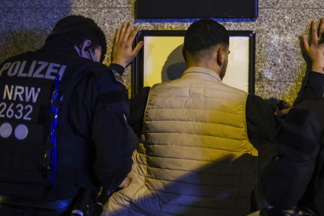 31 October 2024, North Rhine-Westphalia, Duisburg: Police check a man in Duisburg-Hochfeld during an operation to prevent riots. Last year, there were attacks on street cars on Halloween. Photo: Christoph Reichwein/dpa