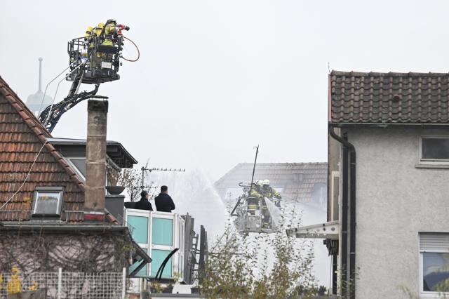 14 November 2024, Baden-Württemberg, Esslingen: Firefighters extinguish a fire in where two dead bodies were found. Photo: Bernd Weißbrod/dpa