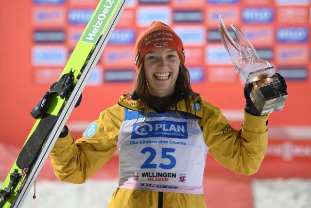 FILED - 03 February 2024, Hesse, Willingen: Katharina Schmid from Germany celebrates at the award ceremony of the women's Nordic skiing during the Ski Jumping World Cup. Schmid won from team-mate Celina Freitag as Germany claimed a third success from four events contested so far at the opening ski jumping weekend of the season in Norway. Photo: Swen Pförtner/dpa