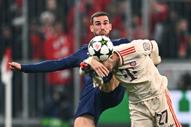 26 November 2024, Bavaria, Munich: Munich's Konrad Laimer (R) and Paris Saint-Germain's Fabian Ruiz battle for the ball during the UEFA Champions League soccer match between FC Bayern Munich and Paris Saint-Germain at the Allianz Arena. Photo: Tom Weller/dpa