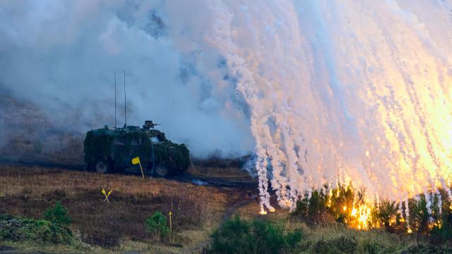 04 December 2024, Lower Saxony, Bergen: A military vehicle ejects smoke bodies during the MILEX24 miliaty exercise. The European Union is conducting a combat exercise with 1,700 soldiers from 15 member states at the Bergen military training area, from November 25th to December 10th. Photo: Philipp Schulze/dpa