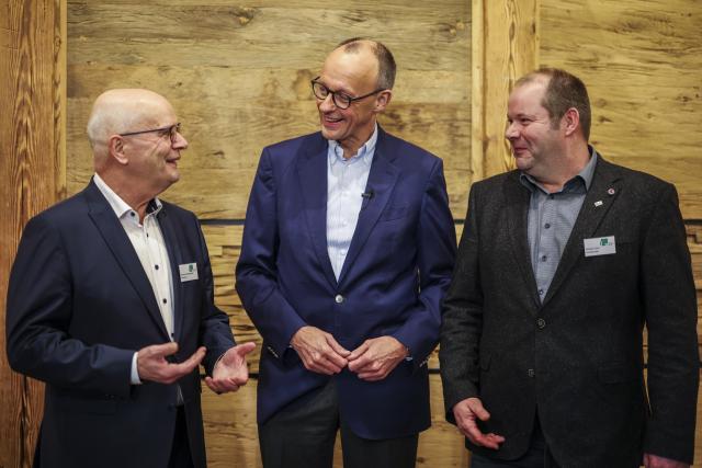 12 December 2024, North Rhine-Westphalia, Olsberg: Christian Democratic Union of Germany (CDU) federal chairman and candidate for chancellor Friedrich Merz (C) talks with President of the Westphalian-Lippish Agricultural Association Hubertus Beringmeier (L) and Wilhelm Kuehn, Chairman of Westphalian-Lippish Agricultural Association at the Westphalian-Lippish Agricultural Association (WLV). Photo: Christoph Reichwein/dpa