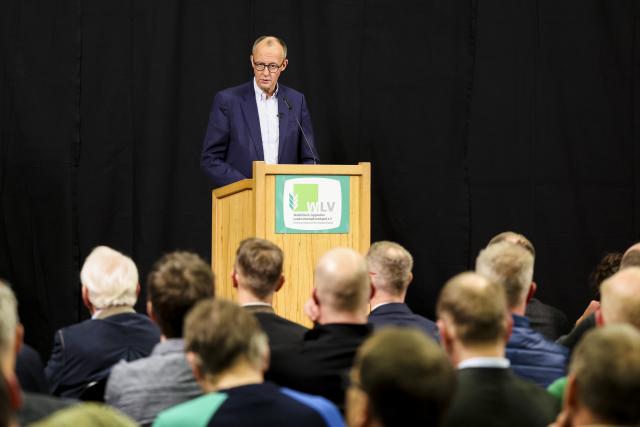 12 December 2024, North Rhine-Westphalia, Olsberg: Christian Democratic Union of Germany (CDU) federal chairman and candidate for chancellor Friedrich Merz speaks at the Westphalian-Lippe Agricultural Association (WLV) on the topic of "Future policy in rural areas". Photo: Christoph Reichwein/dpa