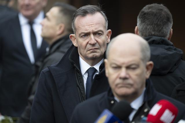 21 December 2024, Saxony-Anhalt, Magdeburg: Germany's Chancellor Olaf Scholz (R) and Volker Wissing, Federal Minister for Digital Affairs and Transport, stand at the site of the fatal attack at Magdeburg's Christmas market. The previous evening, a car driver struck a group of people at the market, resulting in multiple fatalities and injuries. Photo: Sebastian Kahnert/dpa