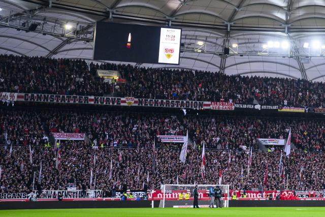 21 December 2024, Baden-Württemberg, Stuttgart: A candle can be seen on the scoreboard during a minute's silence for the victims of the attack at the Magdeburg Christmas market, ahead of the German Bundesliga soccer match between VfB Stuttgart and FC St. Pauli at MHPArena. Photo: Tom Weller/dpa - IMPORTANT NOTE: In accordance with the regulations of the DFL German Football League and the DFB German Football Association, it is prohibited to utilize or have utilized photographs taken in the stadium and/or of the match in the form of sequential images and/or video-like photo series.