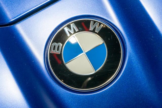 FILED - 03 April 2023, Bavaria, Munich: The BMW logo is attached to the hood of one of the brand's vehicles at BMW Welt. BMW announced on 22 December that it had uncovered irregularities in exports to Russia from its branch in the German city of Hanover. Photo: Peter Kneffel/dpa