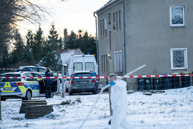 13 January 2025, Brandenburg, Casekow: Emergency services respond to a stabbing attack in an apartment building in Casekow. A 26-year-old woman and a 16-year-old male were killed, while a 19-year-old woman was seriously injured. Police arrested a 27-year-old man, the suspect, with serious injuries. The motive remains unclear. Photo: Fabian Sommer/dpa