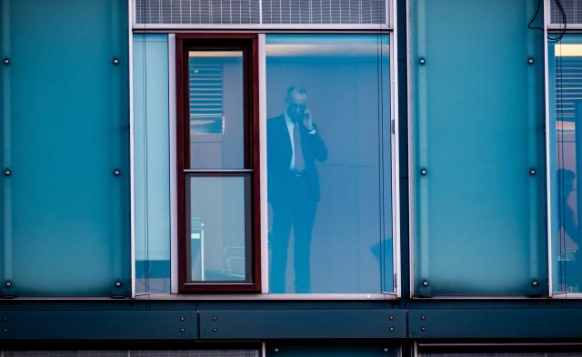 06 March 2025, Berlin: Chairman of the Christian Democratic Union (CDU) Friedrich Merz (R), the party's candidate for chancellor, speaks on the phone at his office ahead of further exploratory talks between the CDU/CSU and SPD on forming a new government after the German Bundestag elections. Photo: Michael Kappeler/dpa