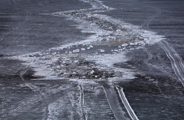 06 March 2025, Bavaria, Grainau: View of the spot on the frozen Lake Eibsee where several people broke through the ice in the afternoon. Photo: Karl-Josef Hildenbrand/dpa