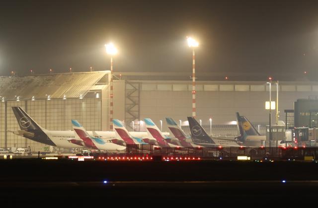 10 March 2025, North Rhine-Westphalia, Duesseldorf: Aircraft park at the terminal building at Duesseldorf Airport in the early morning. The trade union Verdi has called for a 24-hour warning strike by public service and ground handling employees at eleven airports on Monday. Photo: Christoph Reichwein/dpa