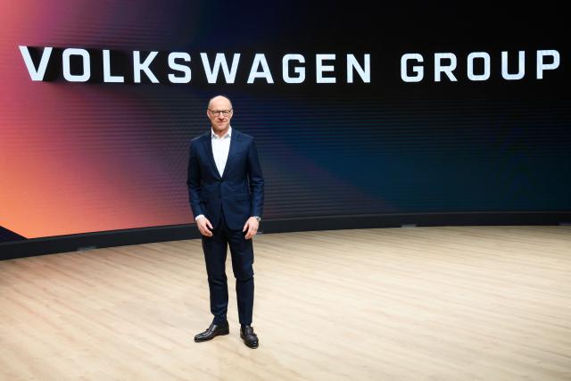 11 March 2025, Lower Saxony, Wolfsburg: Arno Antlitz, Chief Financial Officer of Volkswagen AG, stands in front of a lettering for photographs after the Volkswagen Group's annual press conference in the Autostadt. Photo: Julian Stratenschulte/dpa