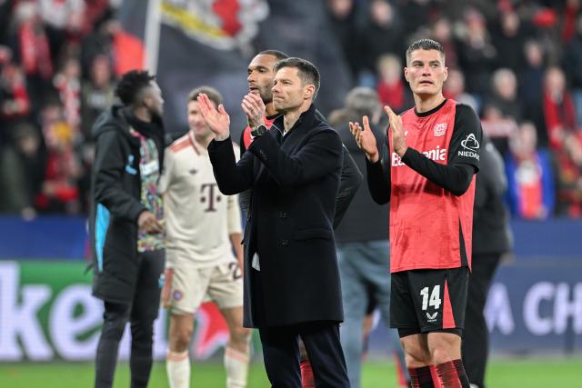 11 March 2025, North Rhine-Westphalia, Leverkusen: Bayer coach Xabi Alonso (C) applauds the fans after the UEFA Champions League round of 16 second leg soccer match between Bayer Leverkusen and Bayern Munich at the BayArena. Photo: Federico Gambarini/dpa