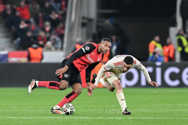 11 March 2025, North Rhine-Westphalia, Leverkusen: Bayer's Jonathan Tah (L) in action against Munich's Jamal Musiala during the UEFA Champions League round of 16 second leg soccer match between Bayer Leverkusen and Bayern Munich at the BayArena. Photo: Federico Gambarini/dpa