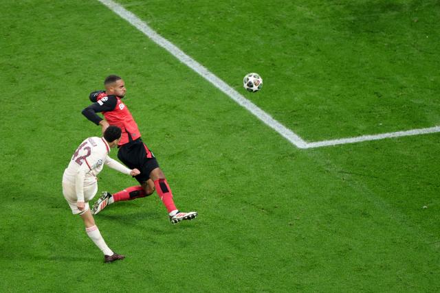 11 March 2025, North Rhine-Westphalia, Leverkusen: Munich's Jamal Musiala (L) and Leverkusen's Jonathan Tah in action during the UEFA Champions League round of 16 second leg soccer match between Bayer Leverkusen and Bayern Munich at the BayArena. Photo: Rolf Vennenbernd/dpa