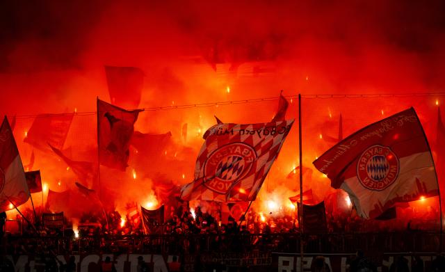 FILED - 05 March 2025, Bayern, München: Bayern fans set off pyrotechnics in the south curve during the UEFA Champions League soccer match between Bayern Munich and Bayer Leverkusen at the Allianz Arena. Bayern Munich have been fined ·61,750 ($67,270) and been handed a suspended partial stadium closure by the ruling body UEFA in connection with incidents at their Champions League match against Bayer Leverkusen. UEFA also fined Benfica ·35,000 for the lighting of fireworks during last week's game against Barcelona in Lisbon, and handed them the same suspended partial stadium closure as Bayern. Photo: Sven Hoppe/dpa