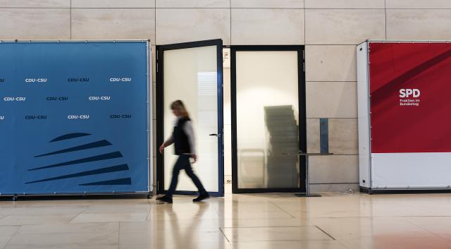 13 March 2025, Berlin: A view of two press walls of the Christian Democratic Union of Germany (CDU)/Christian Social Union in Bavaria (CSU) and Social Democratic Party of Germany (SPD) parliamentary groups in the Bundestag. The Bundestag convenes for a special session to discuss the relaxation of the debt brake for defense spending and the 500 billion special fund. Photo: Hannes P. Albert/dpa