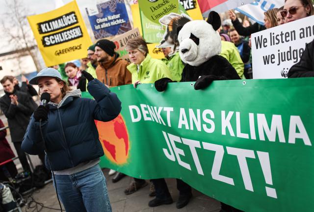 13 March 2025, Berlin: Luisa Neubauer, climate activist, speaks at a protest held by Fridays for Future and Greenpeace activists against the new special fund in front of the Konrad Adenauer House in Berlin. Photo: Hannes P. Albert/dpa