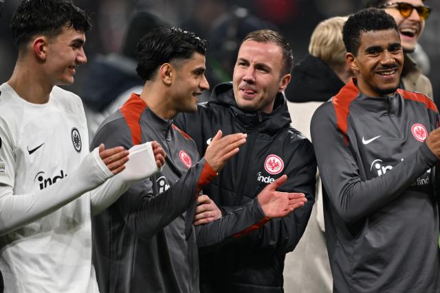 13 March 2025, Hesse, Frankfurt/M.: (L-R)Frankfurt's Can Uzun, Mahmoud Dahoud, Mario Goetze and Ansgar Knauff cheer with the fans after the UEFA Europa League soccer match between Eintracht Frankfurt and Ajax Amsterdam at Deutsche Bank Park. Photo: Arne Dedert/dpa