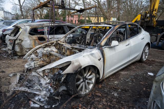 14 March 2025, Berlin: A burnt-out Tesla stands in Berlin's Steglitz district after four Teslas were reportedly set on fire overnight in suspected arson attacks. The State Security Division of the State Criminal Police Office (LKA) is investigating possible extremist involvement, with police stating that a political motive cannot be ruled out. Photo: Christophe Gateau/dpa