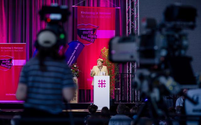 01 May 2025, Lower Saxony, Hanover: Former German Chancellor Angela Merkel speaks at the 39th German Protestant Church Congress. Photo: Moritz Frankenberg/dpa