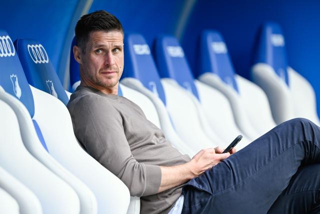 FILED - 26 April 2025, Baden-Württemberg, Sinsheim: Dortmund's sports director Sebastian Kehl sits on the players' bench during the German Bundesliga soccer match between 1899 Hoffenheim and Borussia Dortmund at PreZero Arena. Photo: Uwe Anspach/dpa