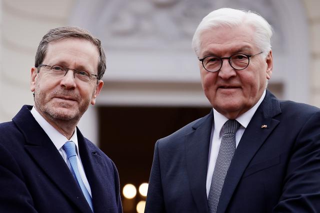 FILED - 16 February 2024, Berlin: Germany's President Frank-Walter Steinmeier (R) welcomes Israeli President Izchak Herzog for talks at Bellevue Palace. Photo: Carsten Koall/dpa
