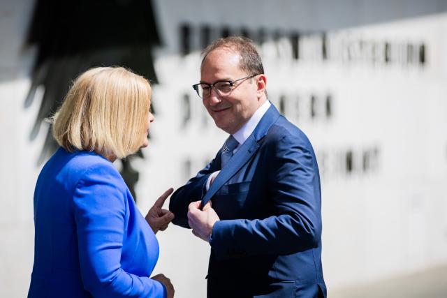 07 May 2025, Berlin: Alexander Dobrindt, new German Minister of the Interior and Home Affairs, and his predecessor Nancy Faeser speak in front of the federal eagle at the protocol entrance to the Federal Ministry of the Interior during a photo session to mark the handover of office. Photo: Christoph Soeder/dpa
