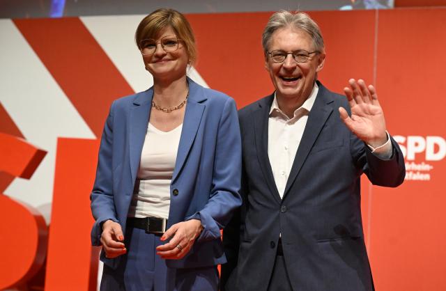 10 May 2025, North Rhine-Westphalia, Duisburg: Sarah Philipp and Achim Post, state chairpersons of the Social Democratic Party (SPD) in North Rhine-Westphalia, thank the delegates after their re-election during the SPD state party conference at the Mercatorhalle. Delegates confirmed the executive committee. Photo: Roberto Pfeil/dpa