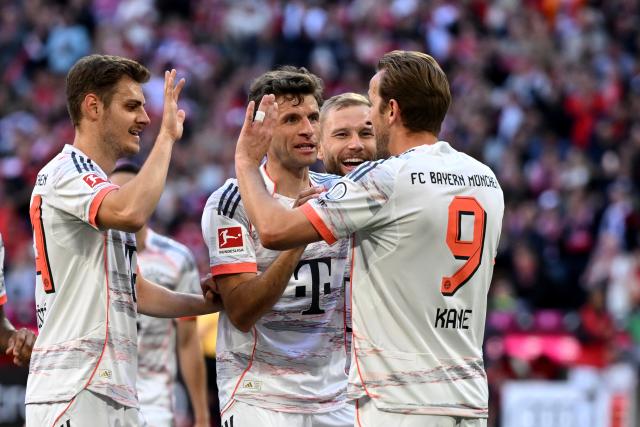10 May 2025, Bavaria, Munich: Munich Harry Kane celebrates scoring his side's first goal with his teammates Thomas Mueller and Josip Stanisic during the German Bundesliga soccer match between FC Bayern Munich and Borussia Moenchengladblach at Allianz Arena. Photo: Sven Hoppe/dpa