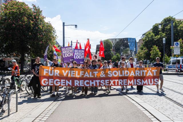 11 May 2025, Baden-Wuerttemberg, Freiburg: Participants in a demonstration march through the city with a banner reading "For diversity & solidarity - against right-wing extremism" during a rally as part of the nationwide day of action "No more excuses - ban the AfD now!", called by the alliance "Together against the right". Photo: Philipp von Ditfurth/dpa
