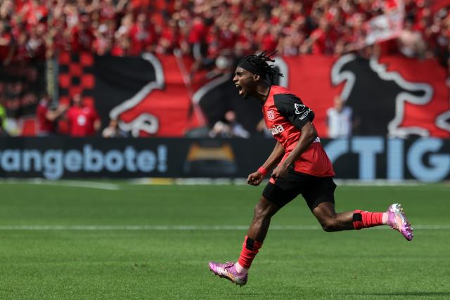 11 May 2025, North Rhine-Westphalia, Leverkusen: Leverkusen's Jeremie Frimpong celebrates scoring his side's first goal during the German Bundesliga soccer match between Bayer Leverkusen and Borussia Dortmund at BayArena. Photo: Rolf Vennenbernd/dpa - IMPORTANT NOTICE: DFL and DFB regulations prohibit any use of photographs as image sequences and/or quasi-video.