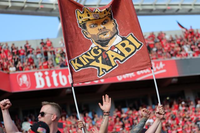 11 May 2025, North Rhine-Westphalia, Leverkusen: Leverkusen fans hold a banner with a picture of Leverkusen coach Xabi Alonso and the words "King Xabi" after the German Bundesliga soccer match between Bayer Leverkusen and Borussia Dortmund at BayArena. Photo: Rolf Vennenbernd/dpa - IMPORTANT NOTICE: DFL and DFB regulations prohibit any use of photographs as image sequences and/or quasi-video.