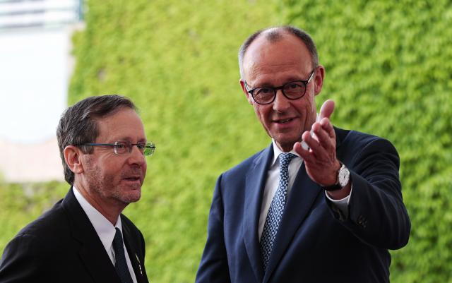 12 May 2025, Berlin: German Chancellor Friedrich Merz (R) receives Israeli President Izchak Herzog ahead of their meeting in front of the Federal Chancellery. Photo: Hannes P. Albert/dpa