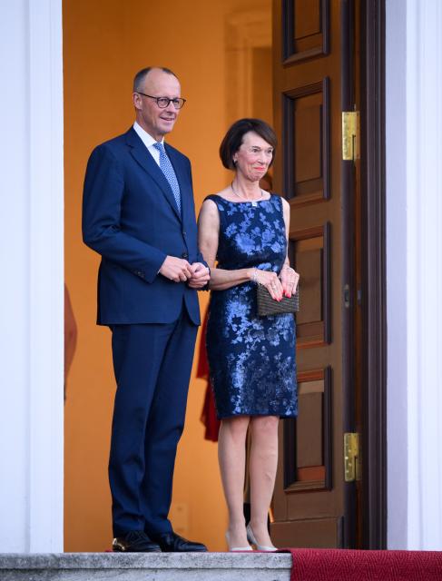 12 May 2025, Berlin: Germany Chancellor Friedrich Merz (L) and his wife Charlotte Merz arrive at Bellevue Palace for a dinner in honor of the Israel's President and his wife. Photo: Bernd von Jutrczenka/dpa
