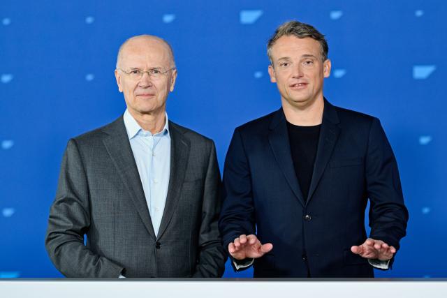 13 May 2025, Baden-Württemberg, Mannheim: Christian Klein (r), CEO of the software group SAP, and Pekka Ala-Pietilae, Chairman of the Supervisory Board, stand on stage at the Annual General Meeting of the software group SAP. Photo: Uwe Anspach/dpa