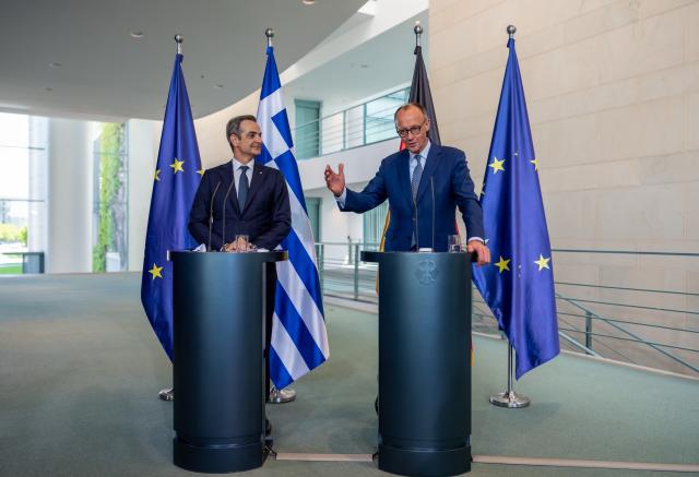 13 May 2025, Berlin: German Chancellor Friedrich Merz (R) speaks during a joint press conference with Greek Prime Minister Kyriakos Mitsotakis following their talks at the German Chancellery. Photo: Michael Kappeler/dpa