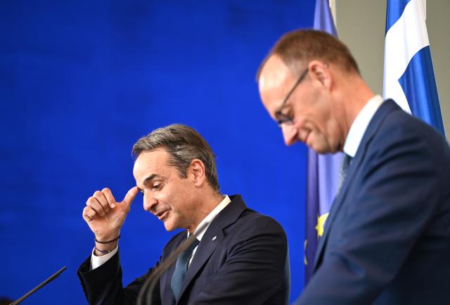 13 May 2025, Berlin: Greek Prime Minister Kyriakos Mitsotakis (L) speaks during a joint press conference with German Chancellor Friedrich Merz following their talks at the German Chancellery. Photo: Katharina Kausche/dpa