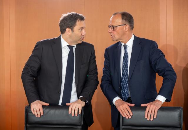 14 May 2025, Berlin: Lars Klingbeil (L), German Minister of Finance, speaks with German Chancellor Friedrich Merz before the start of the second meeting of the German Cabinet in the German Chancellery. Photo: Michael Kappeler/dpa