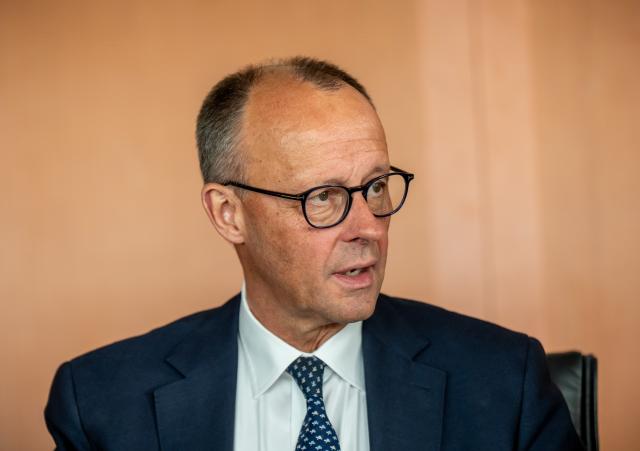 14 May 2025, Berlin: German Chancellor Friedrich Merz waits for the start of the second meeting of the German Cabinet in the German Chancellery. Photo: Michael Kappeler/dpa