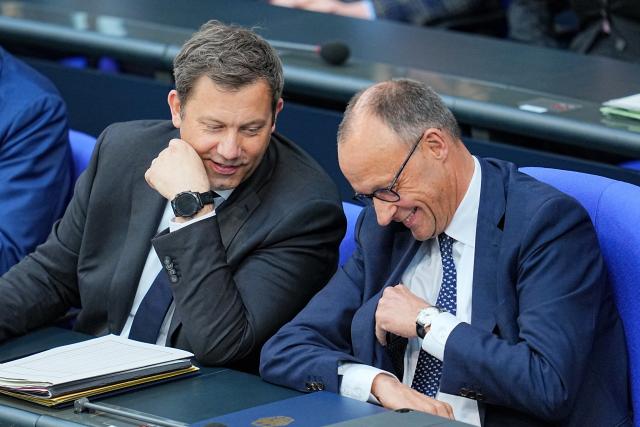 14 May 2025, Berlin: German Chancellor Friedrich Merz (R) and Lars Klingbeil, German Finance Minister, sit in the plenary session of the German Bundestag during the government's questioning. Photo: Michael Kappeler/dpa