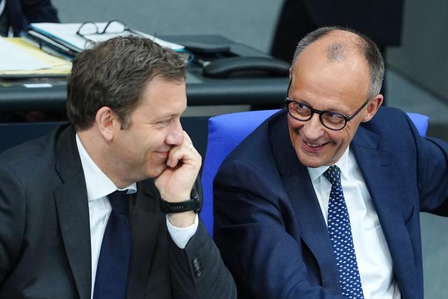 14 May 2025, Berlin: German Chancellor Friedrich Merz (R) and Lars Klingbeil, German Finance Minister, sit in the plenary session of the German Bundestag during the government's questioning. Photo: Kay Nietfeld/dpa