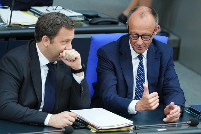 14 May 2025, Berlin: German Chancellor Friedrich Merz (R) and Lars Klingbeil, German Finance Minister, sit in the plenary session of the German Bundestag during the government's questioning. Photo: Kay Nietfeld/dpa