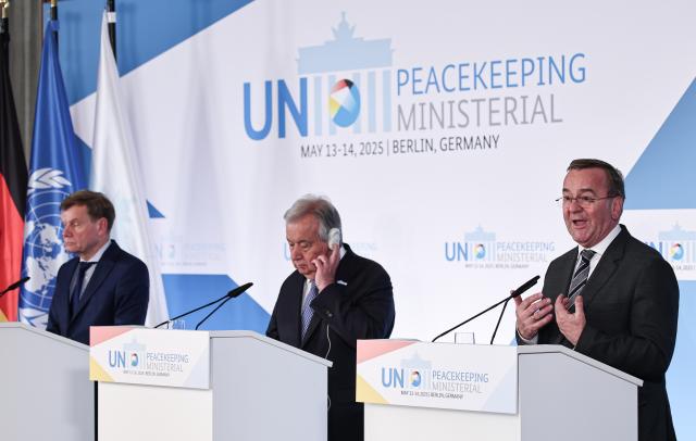 14 May 2025, Berlin: (L-R) Boris Pistorius, German Minister of Defence, Antonio Guterres, Secretary-General of the United Nations, and Johann Wadephul, German Foreign Minister, speak at a joint press conference of the UN Peacekeeping Ministerial 2025 in Berlin, which brings together representatives from over 130 countries to discuss the future of peacekeeping. Photo: Hannes P. Albert/dpa