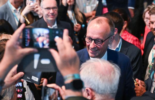 17 May 2025, Baden-Württemberg, Stuttgart: German Chancellor Friedrich Merz enters the meeting room at the at the state party conference of the Christian Democratic Union of Germany (CDU) Baden-Wuerttemberg. Photo: Bernd Weißbrod/dpa